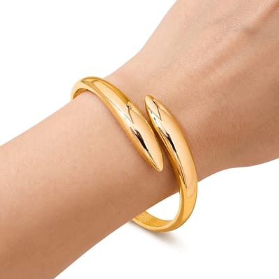 Goudkleurig armband dames open bangle armband geometrische statement armband minimalistische metalen armband met glanzende afwerking moderne armband