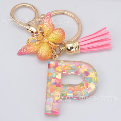 Sleutelhangers of voor je tas van A tot Z - met een pompon of kwastje - met letter - mooi design - handgemaakt - sleutelhangers - design - mode - goud - zwart - blauw - roze- rood