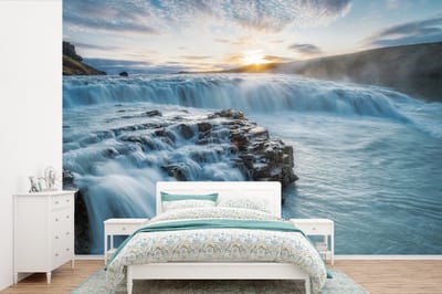 Behang - Fotobehang Waterval - Water - Stenen - Zon - Natuur - Breedte 450 cm x hoogte 300 cm