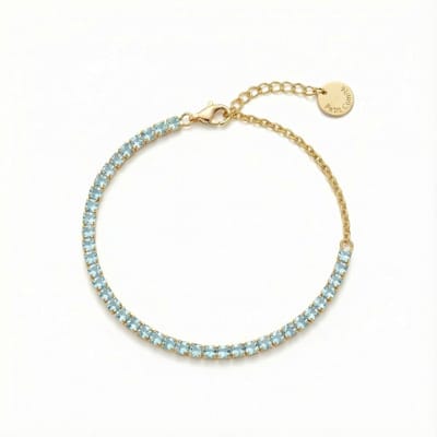 Petit Comité - Armband Dames Goudkleurig Tennis Bracelet - Geboortesteen December Blauwe Topaas - 925 Sterling Zilver - 18k Gold Plated
