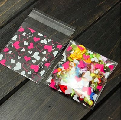ProductGoods - 100x Transparante Uitdeelzakjes - Cellofaan Plastic Traktatie Kado Zakjes - Snoepzakjes Hartjes - Uitdeelzakjes