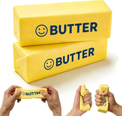 Boter Squishy 2 Stuks - 11cm - Boter-Knijpspeeltje met Lachend Gezichtje - Slow Rising Boter Squishy - Stressverlichtend Fidget Toy voor Volwassenen & Kinderen - Sensorisch Speeltje - Fidget Squishy - Grappig Cadeau & Gadget - Geel