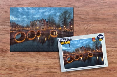 Puzzel Afbeelding van de Amsterdamse Keizersgracht onder een donkere wolkenlucht - Legpuzzel - Puzzel 500 stukjes