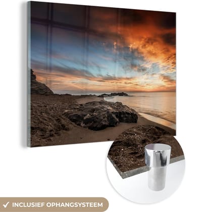 MuchoWow® Glasschilderij 40x30 cm - Schilderij acrylglas - Strand - Stenen - Avond - Lucht - Natuur - Foto op glas - Schilderijen