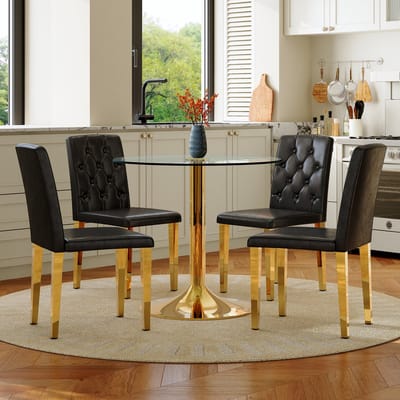 Tafel- en stoelenset: moderne, minimalistische ronde glazen tafel met een diameter van 85 cm en een gouden metalen onderstel, en 4 bijpassende moderne eetkamerstoelen in zwart en goud.