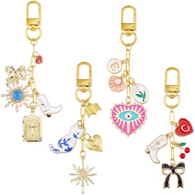 Cosensi- Sleutelhanger Gouden Charms - 4 Stuks Sleutelhanger - Legering/Emaille - Boze Oog/Hart/Kruis/Zon - Elegant/Verfijnd - 107-124 mm Lang - Tasdecoratie