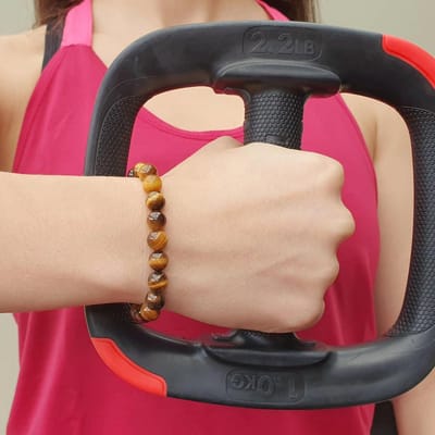 H-Beau - Handgemaakte Armband van Edelstenen - Natuurstenen - Kralen van Gouden Tijgeroog - RVS Kraal - 8mm - lengte 16,5cm - Bruin - oker - Dames - Tiener - Uniseks - Leeuw - Tweeling