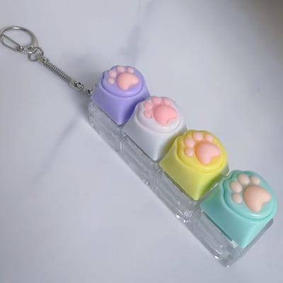 2-delige sleutelhanger met kattenpootjes | Met decompressieknop | Leuke ontwerp, geschikt voor dagelijks gebruik en accessoire-Paars-wit-geel-groen