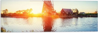 WallClassics - Vlag - Zonlicht langs Hollandse Molen aan het Water - 60x20 cm Foto op Polyester Vlag