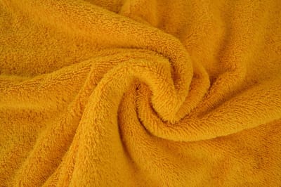 10 meter badstof - Okergeel - 90% katoen - 10% polyester