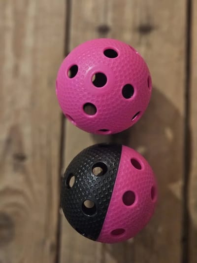 Necy bullet unihockey / floorball ballen - zwart / roze - per twee