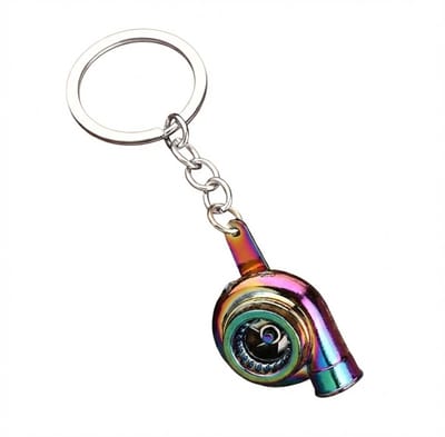 Veelkleurige sleutelhanger turbocharger vorm met metalen sleutelring en korte schakelketting, sleutelhanger voor heren en dames, compact accessoire met mechanisch ontwerp en opvallende iriserende afwerking