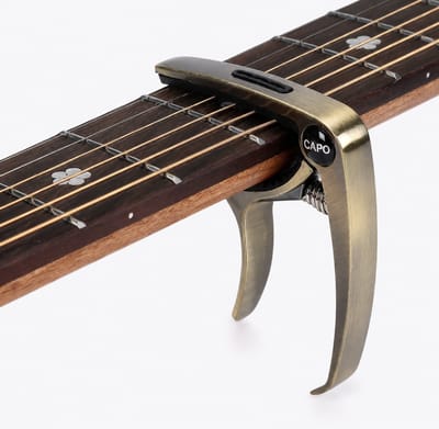 Universele Gitaar Capo - 3-in-1 Capo - Met Plectrumhouder & Brugpin Trekker - Voor Akoestische, Elektrische Gitaar, Ukulele & Mandoline - Antiek Brons
