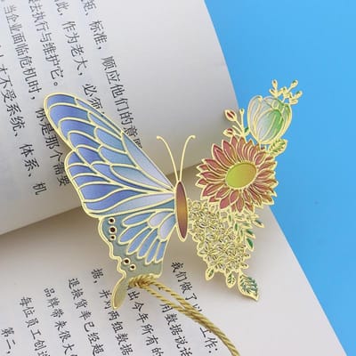 Marque-pages en métal de style chinois avec motif papillon et fleur, exquis et creux, pendentif à pompon, pince à livre, outil de lecture pour étudiants, fournitures scolaires