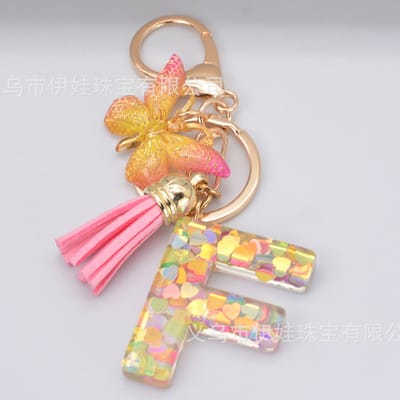 Sleutelhangers of voor je tas van A tot Z - met een pompon of kwastje - met letter - mooi design - handgemaakt - sleutelhangers - design - mode - goud - zwart - blauw - roze- rood