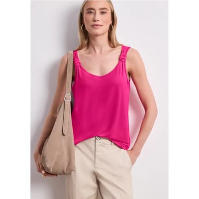 Top met V-hals en knoopdetail