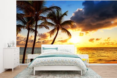 Behang - Fotobehang Strand - Horizon - Zonsondergang - Palmboom - Zee - Breedte 375 cm x hoogte 280 cm