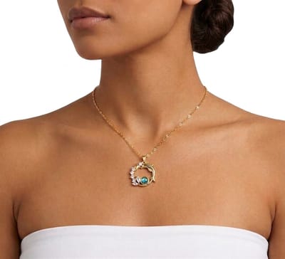 Goudkleurige ketting voor dames met ronde hanger dolfijn ster en strass