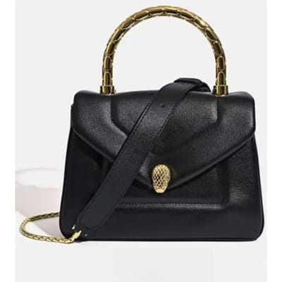 Dit is een modieuze en veelzijdige handtas met slangenkop, ook te dragen als crossbody tas 21*10*15cm zwart
