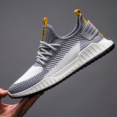 Sportschoenen Heren Nieuwe Casual Vliegweefschoenen Heren Ademende Mode Hardlopen Casual Schoenen Alles-match Trendy Schoenen Heren 44 gray