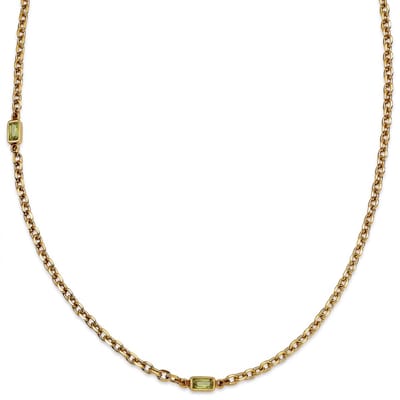 Prism | Goudkleurige ketting met twee limoengroene stenen van kristalglas