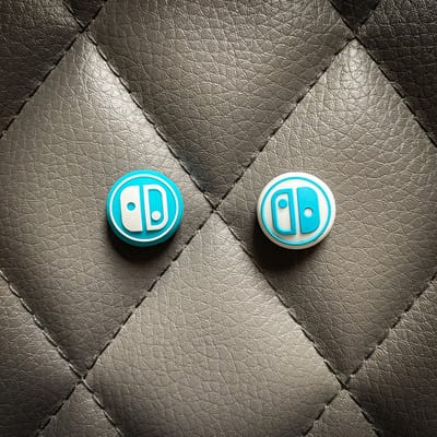 Gaming Thumb Grips - geschikt voor de Nintendo Switch (Oled, Lite) - 1 set = 2 duimgrips - JC blauw/wit