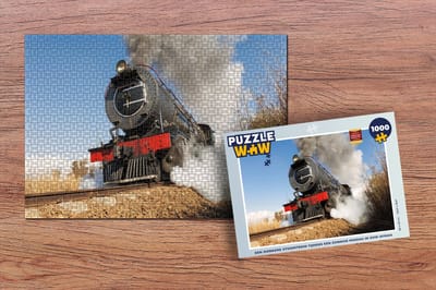 Puzzel Een donkere stoomtrein tijdens een zonnige middag in Zuid-Afrika - Legpuzzel - Puzzel 1000 stukjes volwassenen