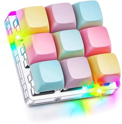 MDUG Toetsenbord Vingertop Speelgoed - Sensorisch Speelgoed - Stressverlichtende Sleutelhanger - Set van 1 - Macaronkleuren - Model met 9 toetsen - Attent Cadeau - Kleurrijke Lichtjes