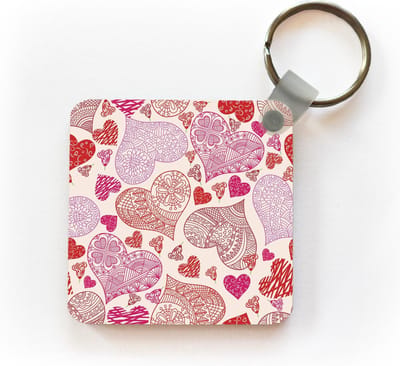 Sleutelhanger - Uitdeelcadeautjes - Een illustratie met roze en rode hartjes - Plastic
