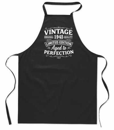 Keukenschort - Schort - BBQ schort - unisex - zwart - 100% katoen - Vintage Limited Edition Aged to Perfection - verjaardag en feest - Geboortejaar 1945