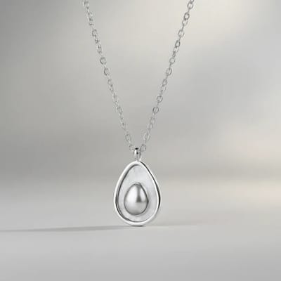 Ketting zilverkleurig - Avocado parelmoer bedel - Stainless steel dames ketting - SK Sieraden - Verstelbaar