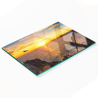 Duurzaam en stijlvol glazen bord met een zonsondergangpatroon (80x52 cm)