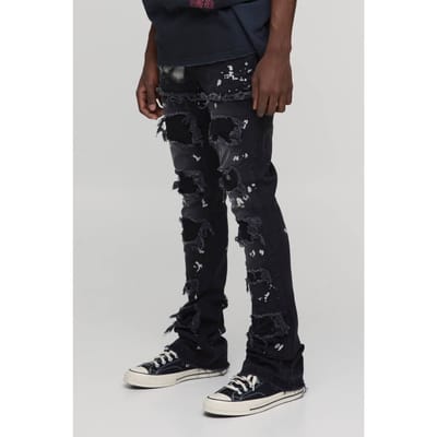 Gestapelde Skinny Extreme Gerafelde Jeans Met Verfspetters En Uitlopende Pijpen | Washed Black | Size 28