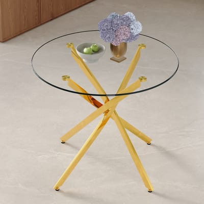 Ronde eettafel in een luxe, lichtgewicht uitvoering met een diameter van 88 cm. Moderne, minimalistische eettafel van gehard glas met een goudkleurig metalen frame, geschikt voor kleinere eetruimtes. Biedt plaats aan 2-4 personen.