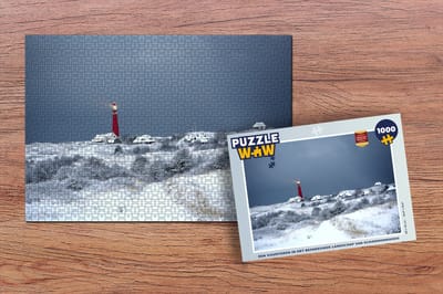 Puzzel Een vuurtoren in het besneeuwde landschap van Schiermonnikoog - Legpuzzel - Puzzel 1000 stukjes volwassenen