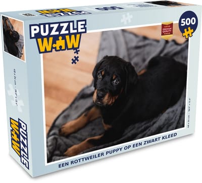 Puzzel Een Rottweiler puppy op een zwart kleed - Legpuzzel - Puzzel 500 stukjes