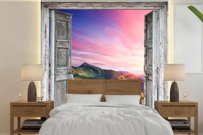 Behang - Fotobehang Bergen - Landschap - Doorkijk - Bloemen - Breedte 220 cm x hoogte 220 cm