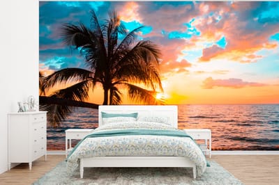Behang - Fotobehang Palm - Zonsondergang - Horizon - Strand - Zee - Tropisch - Breedte 295 cm x hoogte 220 cm