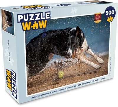 Puzzel Een zwart-witte border collie achtervolgt een tennisbal op het strand - Legpuzzel - Puzzel 500 stukjes