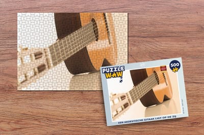 Puzzel Een Akoestische gitaar ligt op de zij - Legpuzzel - Puzzel 500 stukjes
