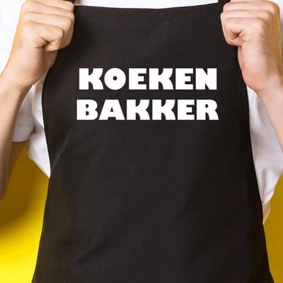 Zwart keukenschort / BBQ-schort met tekst | Koekenbakker | Katoen - One size - Verstelbaar - Wasbaar - Cadeau voor hem - Vaderdag - Gratis verzending - Cadeau voor Kerst & sinterklaas | Incl. 2 jaar garantie