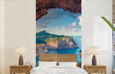 Behang - Fotobehang Grot - Natuur - Zee - Landschap - Breedte 120 cm x hoogte 240 cm
