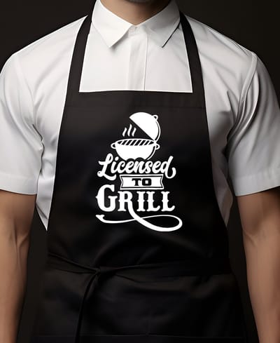 Keukenschort Zwart | 65x90cm | LICENTED TO GRILL | 100% katoen | Schort / Keukenschorten | Verjaardags cadeau | BBQ - VADERDAG - MOEDERDAG - Met tekst