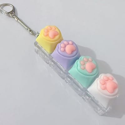 2-delige sleutelhanger met kattenpootjes | Met decompressieknop | Leuke ontwerp, geschikt voor dagelijks gebruik en accessoire-Geel-paars-groen-wit