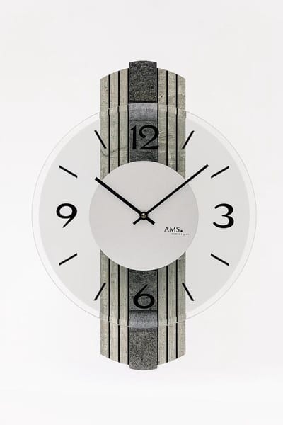 AMS W9675 is een hoogwaardige wandklok met een opvallende houten kast in een stenen structuur look, aangevuld met een echte stenen editie. De klok combineert natuurlijke materialen met een elegant design en is een echte blikvanger in elke woonruimte.