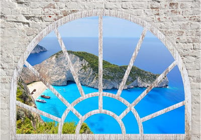 Fotobehangkoning - Behang - Vliesbehang - Fotobehang Uitzicht op Shipwreck Beach vanuit het Raam 3D - Look At The Island Of Dreams - 150 x 105 cm