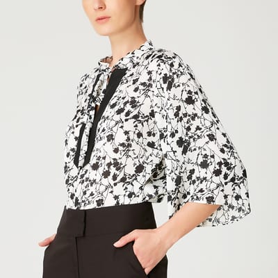 Tulpen mouwen blouse met monochrome bloemenprint en contrasterende halslijn