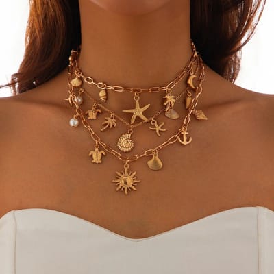 Sorprese Ketting Dames - Ocean Luxe - 3-Laags Goudkleurige Ketting - Met Zon, Schelp & Zeester Hanger - Zomer & Bohemian - Model W