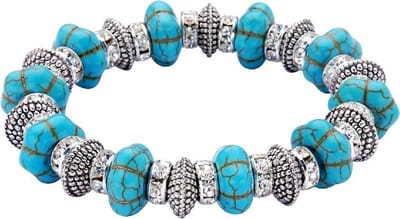 Behave - Armband - Elastische armband met turquoise keramiek kralen en transparante kristal steentjes