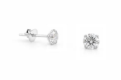zilveren oorknopjes unisex met 4mm kleurloos naturel kristal steentje in zetting